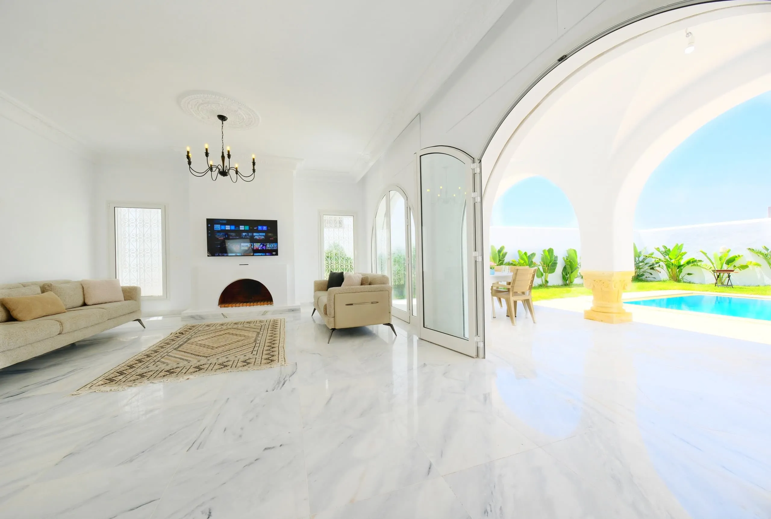 The bright living room with marble floors