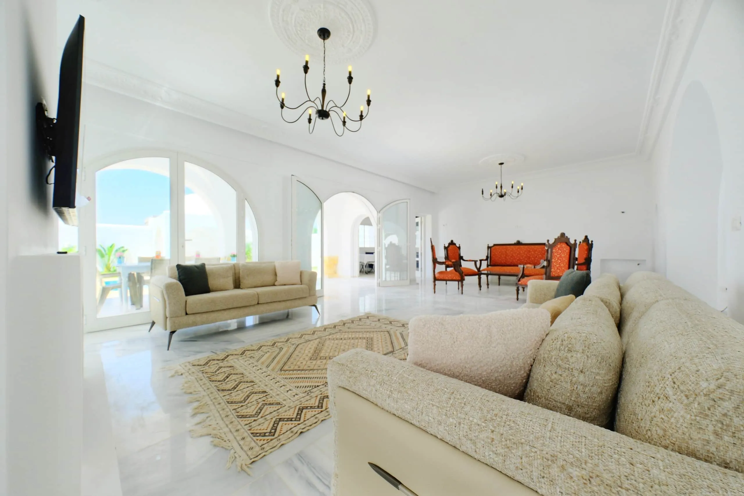 The bright living room with marble floors