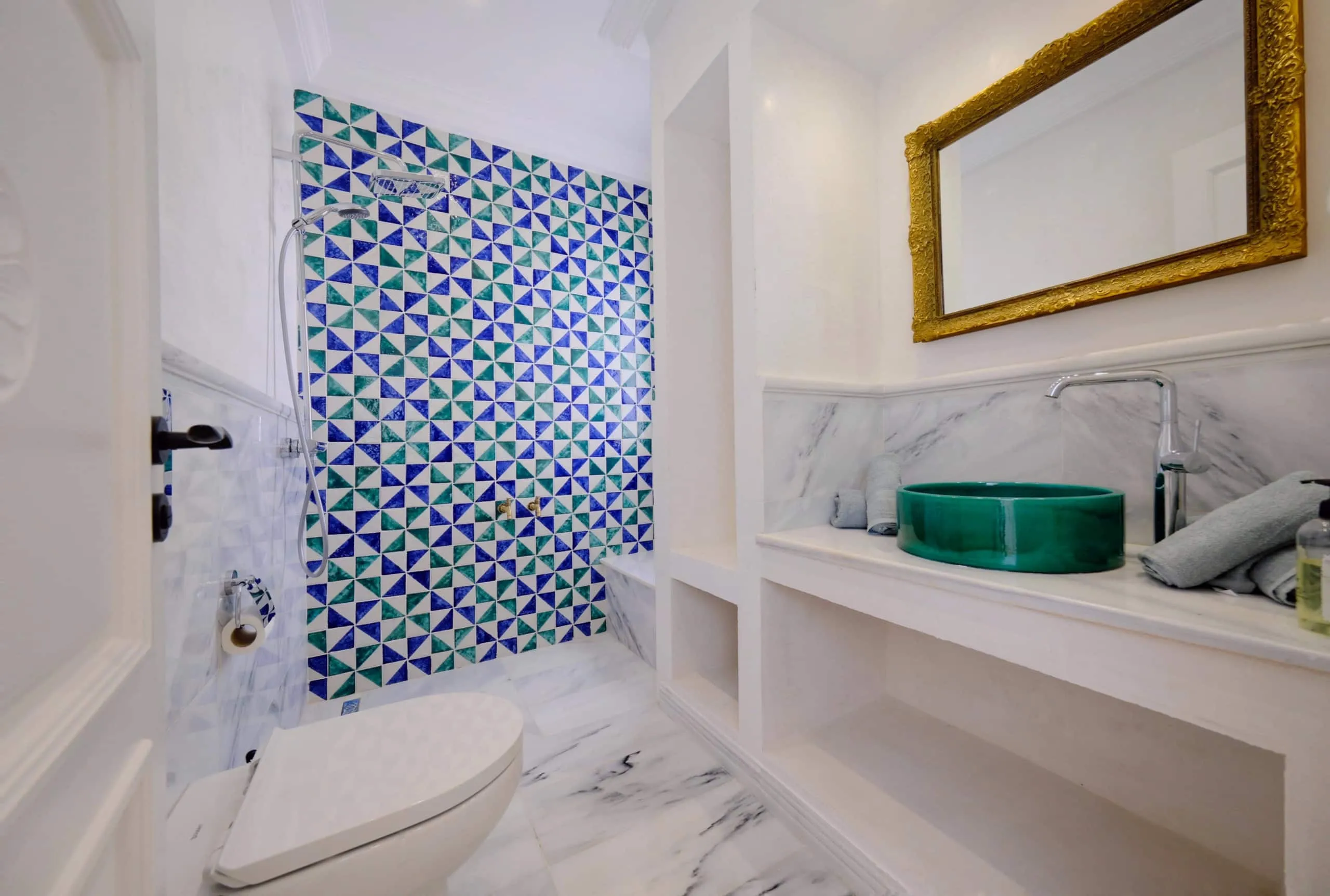 A bathroom in stone and zellige tiles