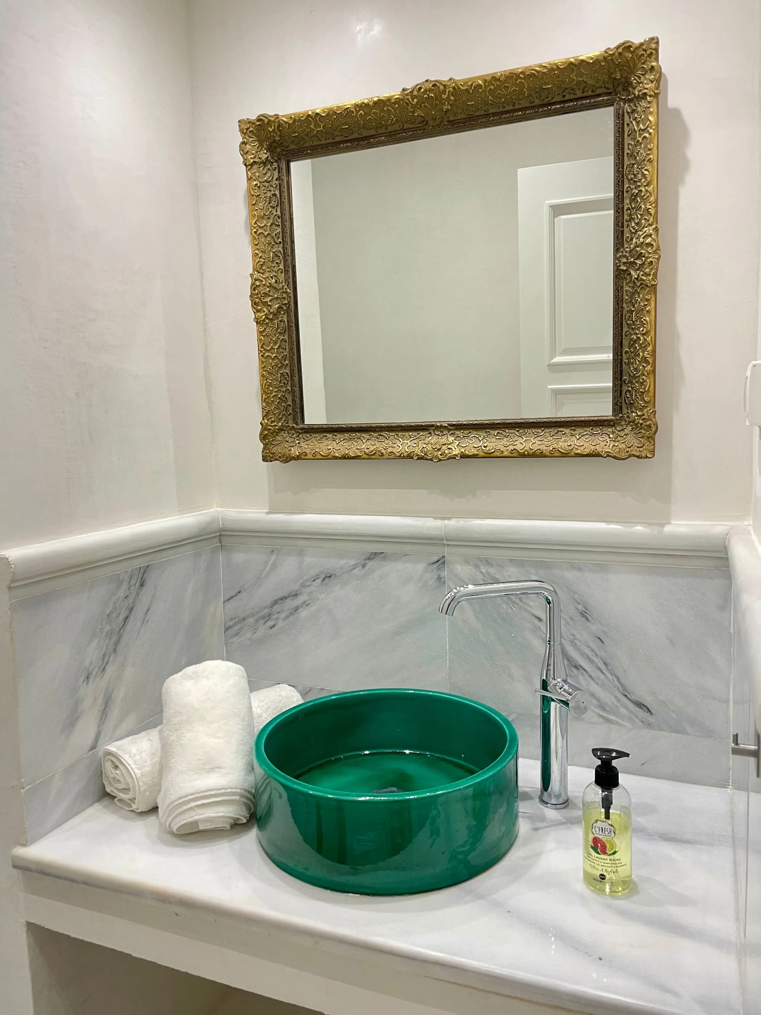 A bathroom in stone and zellige tiles